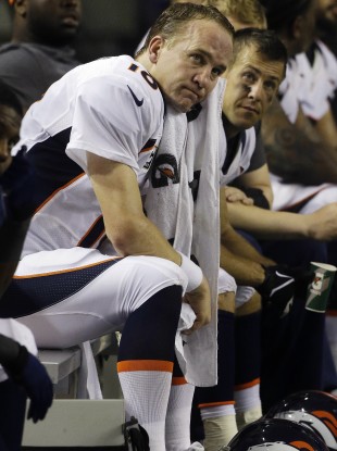 Denver Broncos quarterback Peyton Manning (18) sits on the bench on Monday night.