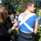 Ben Lesley has a Saltire painted onto his body at a rally for Scottish Independence in Princess Street Gardens, Edinburgh, as thousands of people took to the streets of Edinburgh in one of the largest pro-independence marches the city has seen.