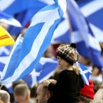 A young supporter attends a rally for Scottish Independence in Princess Street Gardens, Edinburgh, as thousands of people took to the streets of Edinburgh in one of the largest pro-independence marches the city has seen.
