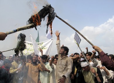 Afghans burn an effigy of U.S. President Barack Obama