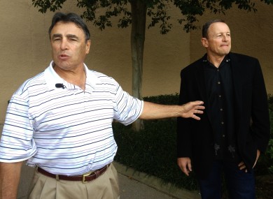 NFL head linesman Tom Stabile, left, and referee Ed Hochuli arrive at an Irving, Texas hotel to vote on an agreement between the two sides.