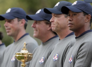 Tiger Woods, far right, and his US team-mates pose with the Ryder Cup for a picture.