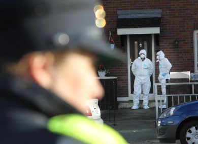Gardaà and forensic examiners outside the house where John Wilson was shot dead last week.