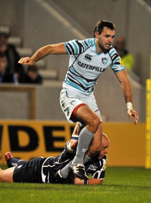 Niall Morris tries to break free against Sale Sharks.
