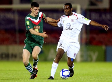 Sligo's Joseph Ndo, right, holds off Brian Lenihan.
