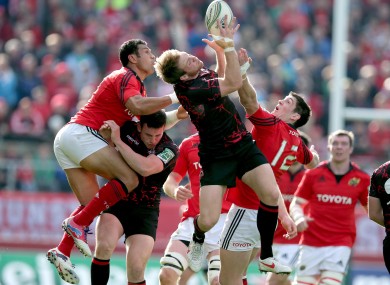 Munster's Casey Laulala and James Downey contest a high ball.
