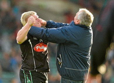 James Kelly, Newcastlewest, is confronted on the pitch by a supporter shortly after he was shown a second yellow card and subsequently a red card by referee Richard Moloney in yesterday's Limerick county final.