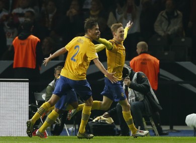 Rasmus Elm, right, celebrates the Swedish equaliser in Munich last month.
