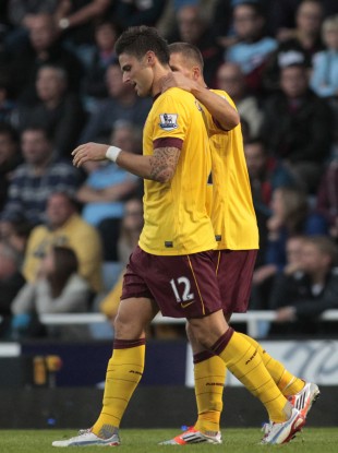 Giroud celebrates his first Premier League goal for the club.
