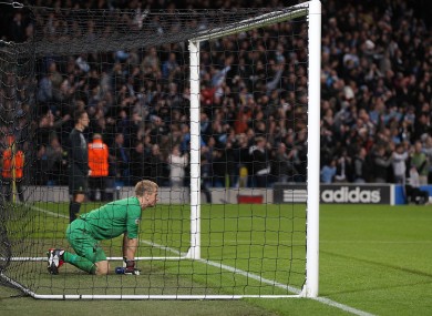 Hart kneeling in his goal as Balotelli takes a penalty down the other end.