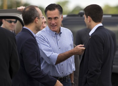 Mitt Romney (centre) talks with foreign policy adviser Dan Senor, left, and his vice presidential running mate Paul Ryan.