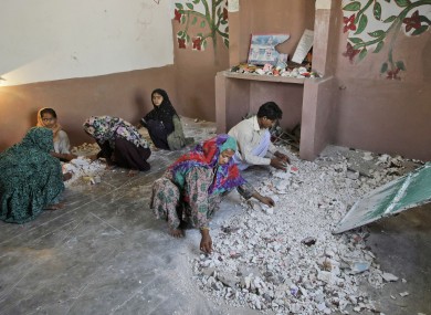 Hindus clean a temple after being attacked by a group of men in Karachi, Pakistan.