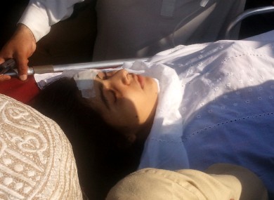 Malala Yousufzai being moved to a helicopter to be taken to Peshawar for treatment