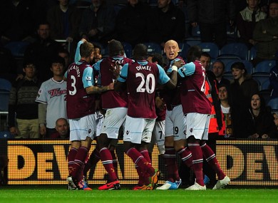 West Ham United's Ricardo Vaz Te (obscured) celebrates with team-mates after scoring his team's second goal.
