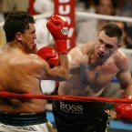 Sanders (left) defeated Wladimir Klitschko to win the WBO World Heavyweight Championship in 2003. He was fatally wounded during an armed robbery this year. Image: AP Photo/Joe Cavaretta