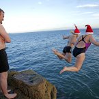 Participants in the annual Christmas Day swim at the Forty Foot  in Sandycove,Dublin.
PRESS ASSOCIATION Photo. Picture date: Tuesday December 25, 2012. Stand Alone picture. Photo credit should read: Julien Behal/PA Wire.