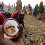 An Indian Hindu holy man puts vermilion paste after taking a dip at Sangam (AP Photo/Rajesh Kumar Singh)
