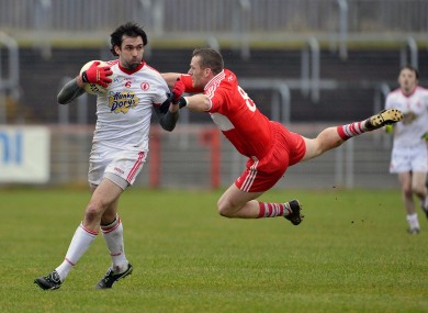 Tyrone's Joe McMahon and Derry's Paddy Bradley.