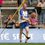 Mullane throws away his hurl in the dying moments of a game where Waterford are well beaten but he shines as he notches 0-8 from play.