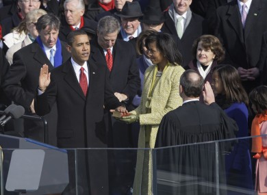 A youthful looking Barack Obama being sworn in for his first term four years ago