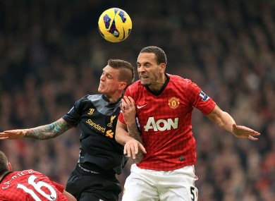 Manchester United's Rio Ferdinand (right) and Liverpool's Daniel Agger (left) battle for the ball.