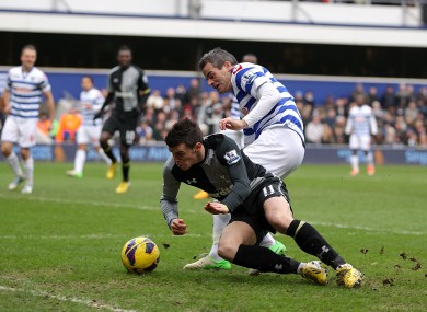 Tottenham Hotspur's Gareth Bale goes down in the area after a battle for the ball with Queens Park Rangers' Ryan Nelsen.