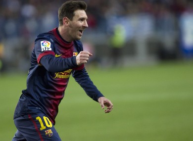 FC Barcelona's Lionel Messi from Argentina celebrates his goal during a Spanish La Liga soccer match against Malaga at the Rosaleda stadium.