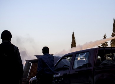 Free Syrian Army fighters fire a rocket during clashes with government forces in Aleppo, Syria yesterday.
