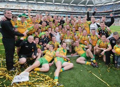 The Donegal players celebrate with the Sam Maguire last September.