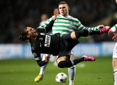 Celtic's Gary Hooper and Juventus's Martin Caceres.