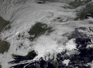 This image made available by NOAA shows storm systems over the eastern half of the United States on Thursday
