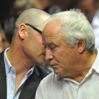 Carl and Henke Pistorius talk during the hearing. ©Pic Chris Ricco/BackpagePix