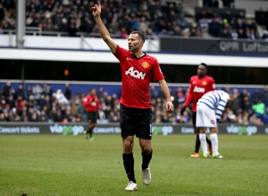 Ryan Giggs salutes fans after scoring.