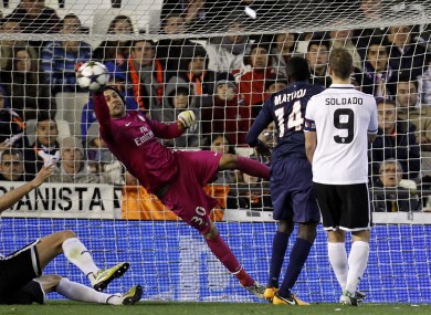 Paris Saint-Germain's goalkeeper Salvatore Sirigu blocks a shot from Valencia during their Champions League round of 16 soccer match.