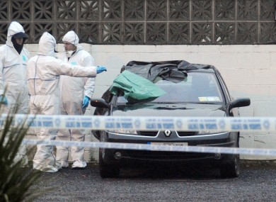 A car at the scene of the fatal shooting yesterday