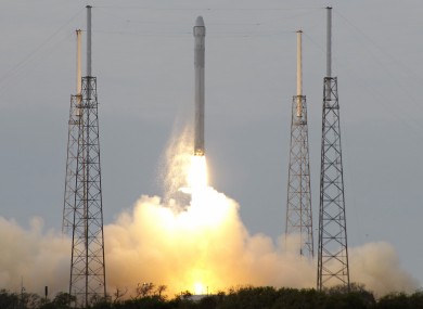 The Falcon 9 SpaceX rocket lifts off.