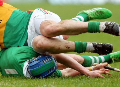 Seamus Hickey of Limerick is tackled against Carlow.